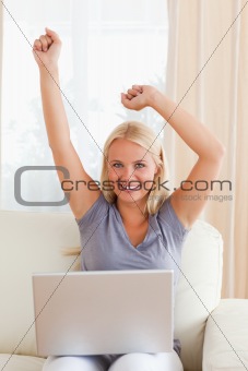 Portrait of a cheerful woman using a laptop