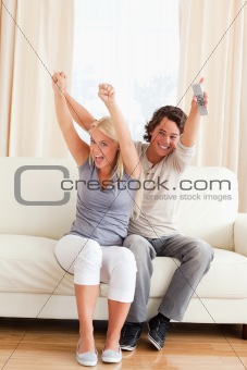Portrait of a young couple cheering up