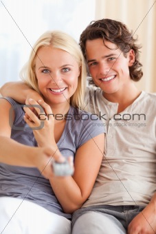 Portrait of a lovey couple watching TV