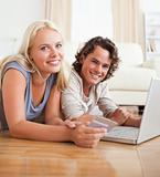 Cute couple booking their holidays online