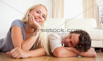 Lovely couple lying on the floor