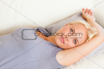 Cute woman lying on a sofa