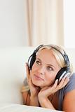 Portrait of a blonde woman enjoying some music