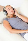 Portrait of a gorgeous woman listening to music