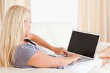 Blonde woman using a laptop
