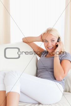 Portrait of a smiling woman making a phone call
