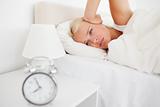Woman awaken by her alarn clock