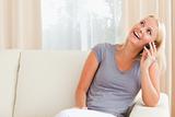 Laughing woman speaking on the phone