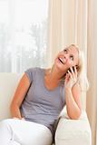 Portrait of a happy woman speaking on the phone