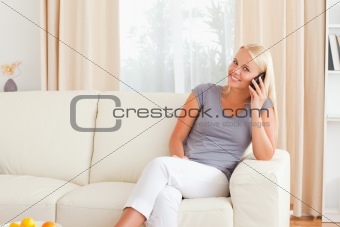 Happy woman speaking on the phone