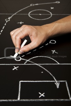 Hand drawing a soccer game strategy