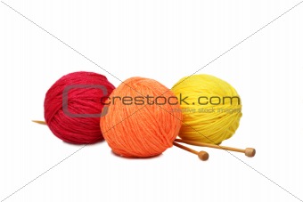 Colorful yarn balls over white