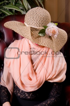 woman in a decorative hat