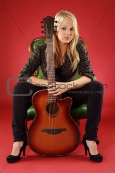 Blond female with acoustic guitar
