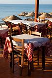Outdoor restaurant tables in Perissa, Santorini, Greece