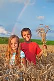 Kids in wheat field at harvest time