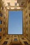 Blue sky framed by building