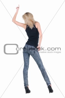 Young woman dancing. Rear view.