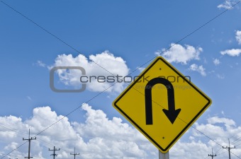 u-turn symbol and blue sky