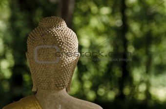 behind buddha statue in Thailand