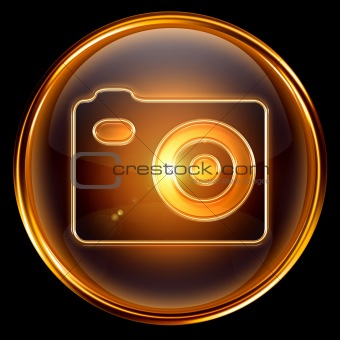 Camera icon golden, isolated on black background.