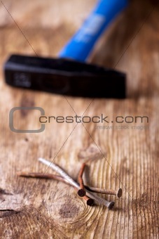 closeup of rusty nails on a wooden plank