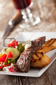 detail of a steak with salad
