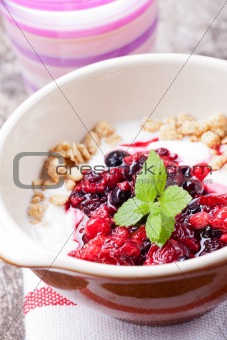 closeup of breakfast cereals with fruits and yoghurt