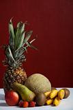 pineapple and other fruits on a table