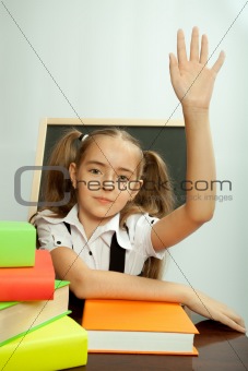 School girl ready to answer for teacher question
