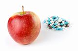 An Apple and a Pile of Medication Pills