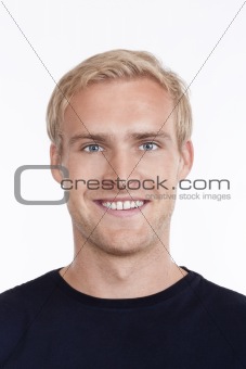 portrait of a young man with blond hair and blue eyes - isolated on white