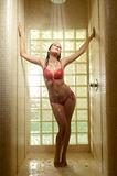 woman in swimsuit takes shower