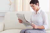 Beautiful woman reading the news