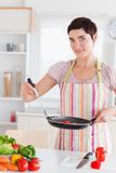 Gorgeous woman with a pan