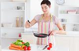 Cute woman cooking