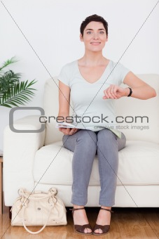 Smiling brunette Woman with a bag and a magazine