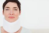 Close up of a sad Woman with a surgical collar