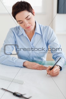 Woman working on an architectural plan