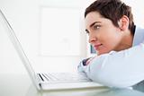 Brunette short-haired businesswoman with a laptop