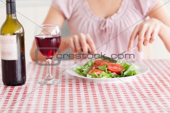 Cute Woman eating lunch and drinking wine