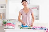 Cute Woman ironing clothes