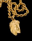 Gold pendant in shape the face of Christ