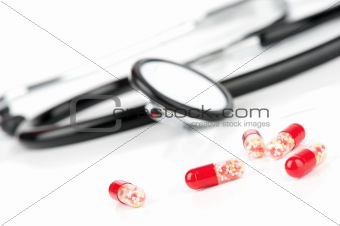 Doctor's stethoscope and pills