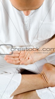Man meditating hand