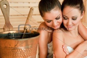 females hugging sauna