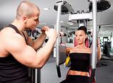 Female in the gym with trainer