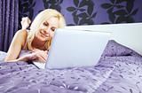 female chat bed laptop