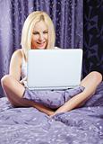 Woman bed laptop