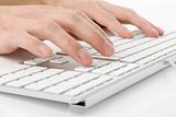 male hands typing on a keyboard